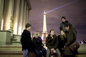 Students talking with the Eiffel Tower in the background