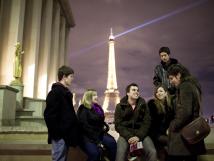 Students talking with the Eiffel Tower in the background
