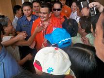 Filipino politician Joseph Estrada surrounded by people