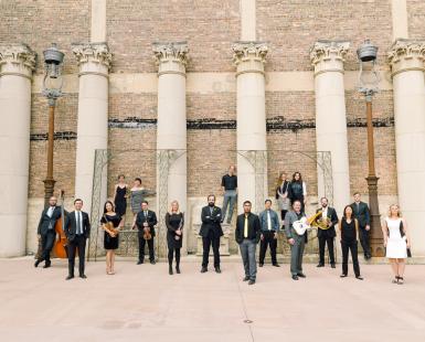 Group of people with Instruments pose for a picture