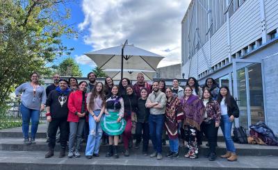 A group of workshop participants gather outside