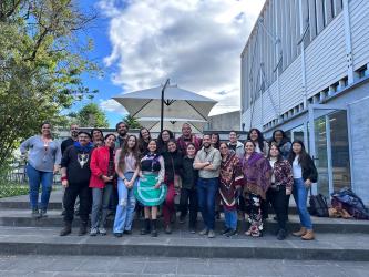 A group of workshop participants gather outside