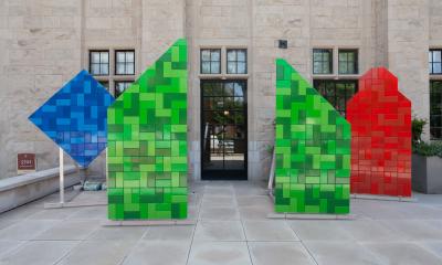 Blue, Green and Red sculptures in front of Neubauer Collegium entrance
