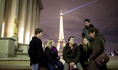 Students talking with the Eiffel Tower in the background