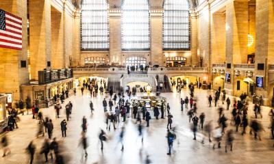 Timelapse photo of people walking in and out of a building