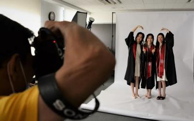 Students take graduation photos