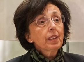 Woman wearing a green scarf talking