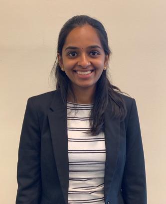 Woman wearing a blazer posing for a picture