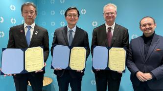 (From left): President Teruo Fujii of the University of Tokyo, President Hong Lim Ryu of Seoul National University, President Paul Alivisatos of UChicago and Jesus Mantas of IBM Consulting attend a Jan. 18 signing ceremony at the World Economic Forum in Davos, Switzerland.